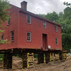 A historical house raised to prepare for a new foundation - Payne Construction Services
