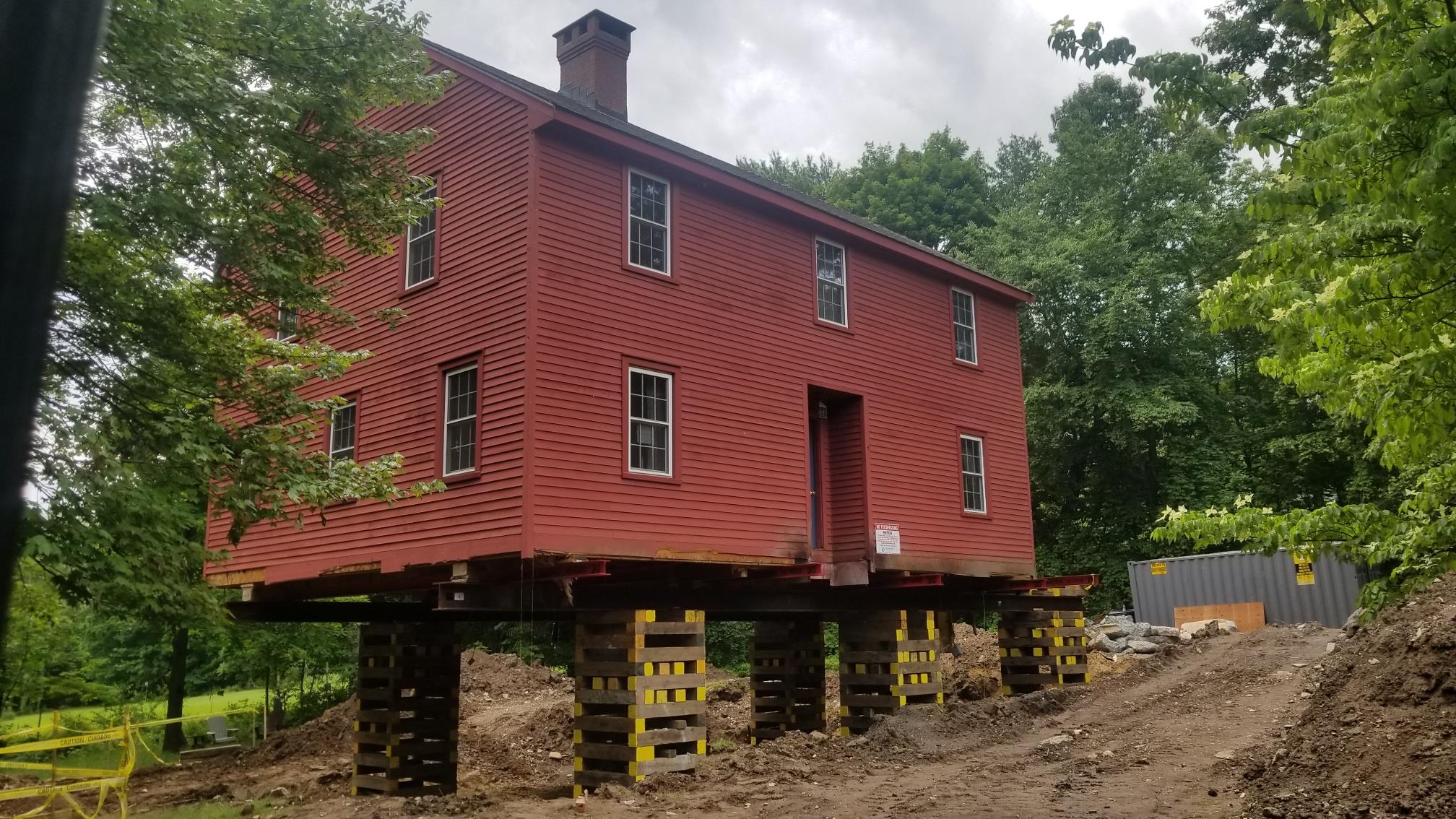 A historical house raised to prepare for a new foundation - Payne Construction Services