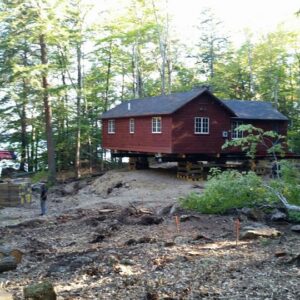 A house in the woods lifted above the ground - Payne Construction Services