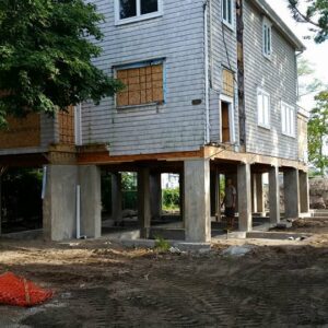 A large house raised with new foundation supports - Payne Construction Services