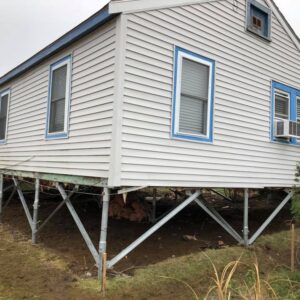A house raised several feet with helical piles - Payne Construction Services