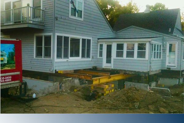 house in process of being lifted or jacked