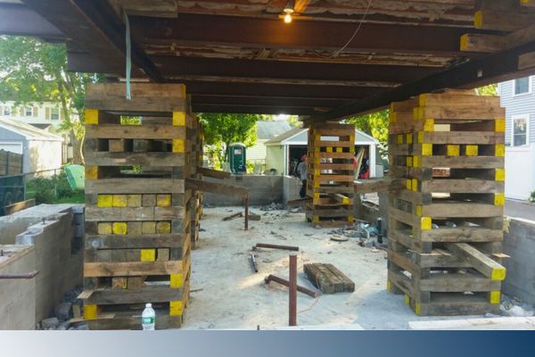house in process of being lifted or jacked