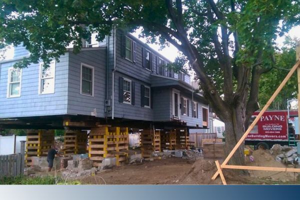 house in process of being lifted or jacked