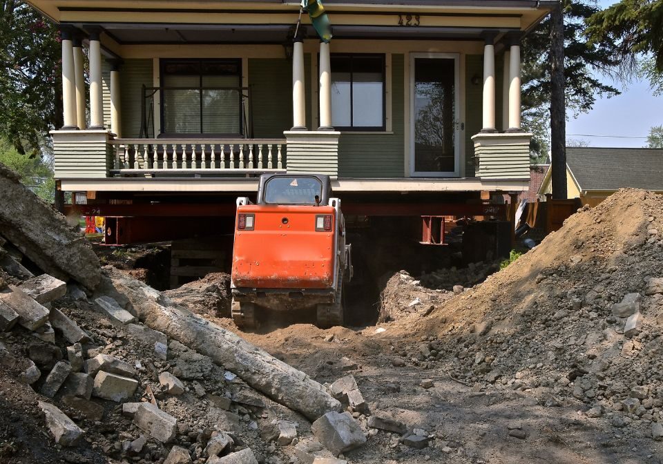a home being lifted onto stilts