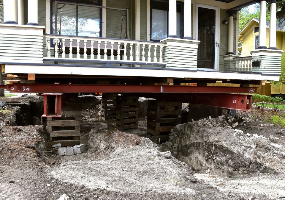 a home being supported by metal beams