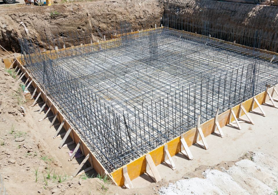 a new foundation being poured over rebar