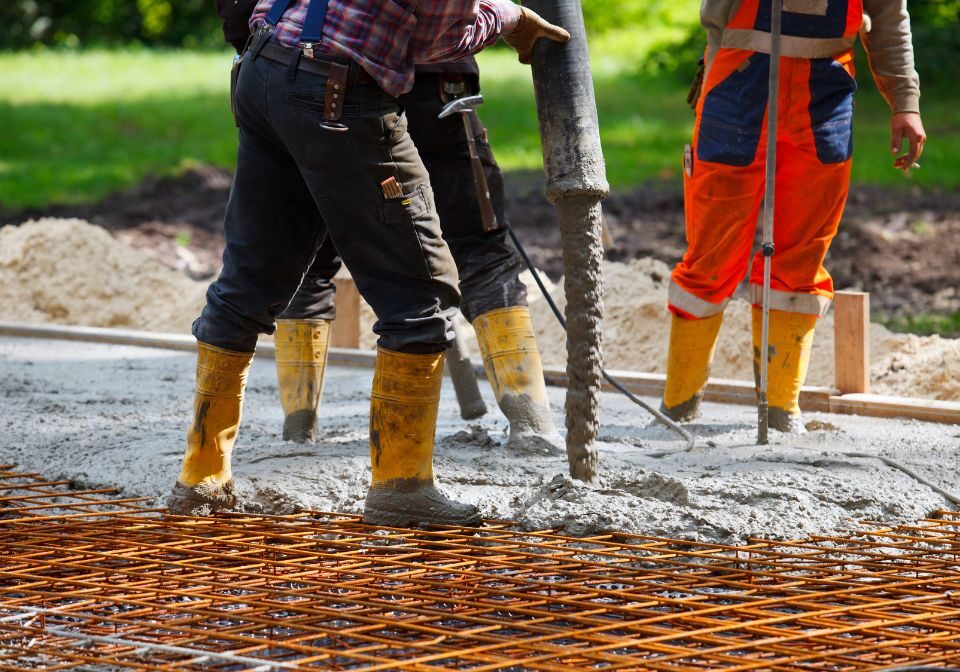 a professional pouring concrete