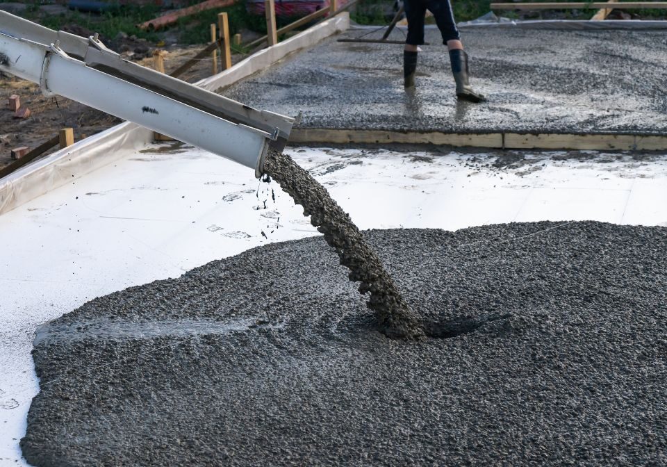 a cement truck pouring a foundation